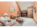 Cozy living room featuring a fireplace and ample natural light at 2718 S Victor St, Aurora, CO 80014