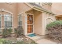 Inviting entryway with a wooden door and neatly landscaped surroundings at 2718 S Victor St, Aurora, CO 80014