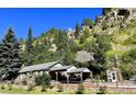 Charming single-story home nestled in the mountains with a greenhouse at 4364 Colorado 103, Idaho Springs, CO 80452