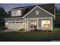 Two-story home with gray siding, stone accents, and dormer windows at 374 Josef Cir, Fort Lupton, CO 80621