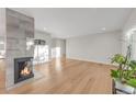 Living room with hardwood floors and fireplace at 3955 S Uinta St, Denver, CO 80237
