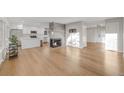 Bright living room with hardwood floors and fireplace at 3955 S Uinta St, Denver, CO 80237