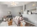 Open concept living room and kitchen area at 3231 E 103Rd Pl # 308, Thornton, CO 80229