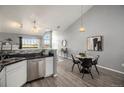 Modern kitchen featuring stainless steel appliances and a breakfast bar at 3231 E 103Rd Pl # 308, Thornton, CO 80229