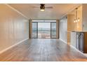 Living Room with hardwood floors, mountain views, and ceiling fan at 2 Adams St # 1204, Denver, CO 80206