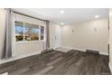 Bright entryway with hardwood floors and a view to the backyard at 1860 Pecos Way, Denver, CO 80221