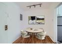 Small dining area with round table and four chairs at 85 N Grant St # 22, Denver, CO 80203