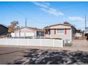 Ranch home with a detached garage and a fenced yard at 712 Locust Ave, Lochbuie, CO 80603