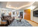 Finished basement features a comfortable sitting area, large TV, and ample storage at 24087 Deer Valley Rd, Golden, CO 80401