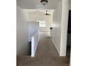 Spacious hallway with carpeted floors and stairs at 894 S Krameria St, Denver, CO 80224