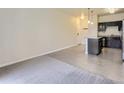 Living room with wood-look floors and carpet at 4100 Albion St # 512, Denver, CO 80216