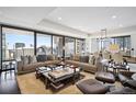 Luxurious living room with city views, modern furniture, and large windows at 1133 14Th St # 2620, Denver, CO 80202
