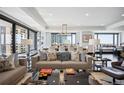 Open concept living room and dining area with city views and modern decor at 1133 14Th St # 2620, Denver, CO 80202