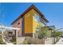 Modern two-story home with yellow and gray exterior at 1998 Foxtail Ln # B, Lafayette, CO 80026