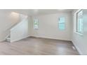 Spacious living room featuring hardwood floors and large windows at 4675 Portside Way, Boulder, CO 80301