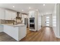 Modern kitchen with island and open floor plan at 42996 Colonial Trl, Elizabeth, CO 80107