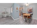 Bright dining area with wood table and leather chairs at 1260 York St # 105, Denver, CO 80206