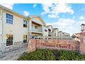 Hunters Chase townhomes with landscaping and signage at 18633 Stroh Rd # 1-204, Parker, CO 80134