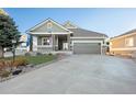 Two-story house with attached garage and front porch at 8796 E 150Th Ct, Thornton, CO 80602