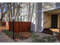 Townhome exterior with wooden fence and landscaping at 1050 S Monaco Pkwy # 88, Denver, CO 80224