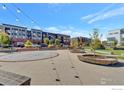 Outdoor courtyard with seating and string lights at 692 Central Park Cir, Superior, CO 80027