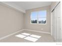 Bright bedroom with a large window and ample sunlight at 310 S Cherrywood Dr # 101, Lafayette, CO 80026