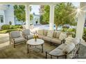 Relaxing patio furniture with a view of the pool and landscaping at 7484 N 49Th St, Longmont, CO 80503