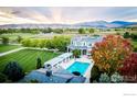 Luxury home with pool and pergola, nestled in a scenic landscape at 7484 N 49Th St, Longmont, CO 80503
