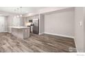 Modern kitchen with island and stainless steel appliances at 290 S Cherrywood Dr # 102, Lafayette, CO 80026