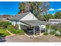 House exterior with covered patio and landscaping at 12027 Saint Vrain Rd, Longmont, CO 80504