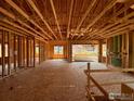 Interior of a house under construction, showing the wooden frame at 461 Muirfield Cir, Louisville, CO 80027