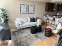 Open concept living room with neutral decor and access to kitchen at 4524 14Th St # 7D, Boulder, CO 80304