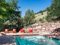 Inviting pool area with stone patio and mountain views at 3015 3Rd St, Boulder, CO 80304