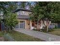 Modern two-story home with gray siding and a landscaped front yard at 2870 18Th St, Boulder, CO 80304