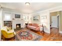 Cozy living room featuring a fireplace, hardwood floors, and comfortable seating at 945 Lincoln Pl, Boulder, CO 80302