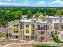 Aerial view of a multi-unit building with a mix of architectural styles at 310 S Cherrywood Dr # 301, Lafayette, CO 80026