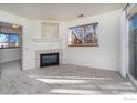 Bright living room with fireplace and carpet at 2850 Aurora Ave # 112, Boulder, CO 80303