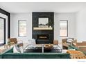 Modern living room with a fireplace and large windows at 503 Hawthorn Ave, Boulder, CO 80304