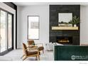 Modern living room with a fireplace and large windows at 503 Hawthorn Ave, Boulder, CO 80304