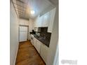 Efficient kitchen featuring granite countertops and hardwood floors at 1650 N Pearl St # 17, Denver, CO 80203