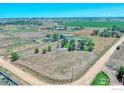 Aerial view of a house with large lot and outbuildings at 19150 E 195Th Ave, Hudson, CO 80642