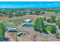 Aerial view showing a house, detached garage, and RV at 19150 E 195Th Ave, Hudson, CO 80642
