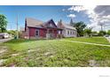 Wide view of craftsman home and yard at 730 6Th St, Berthoud, CO 80513