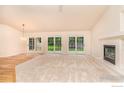 Spacious living room with hardwood floors and fireplace at 342 Driftwood Cir, Lafayette, CO 80026