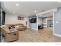 Open concept living and dining area with hardwood floors and neutral decor at 3726 E 112Th Pl, Thornton, CO 80233