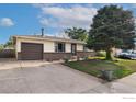 Charming Ranch home with a neatly landscaped yard and attached garage at 3726 E 112Th Pl, Thornton, CO 80233