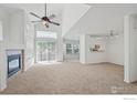 Spacious living room with fireplace and vaulted ceiling at 13900 Lake Song Ln, Broomfield, CO 80023