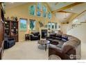 Large living room with vaulted ceilings and a cozy fireplace at 114 E 14Th Ct, Broomfield, CO 80020