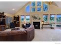 Vaulted ceilings and a stone fireplace highlight this spacious living room at 114 E 14Th Ct, Broomfield, CO 80020