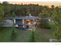 Contemporary home nestled in a wooded area, showcasing its unique design at 271 Anemone Dr, Boulder, CO 80302